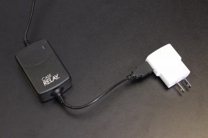 Case Relay Power System plugged into a power adapter